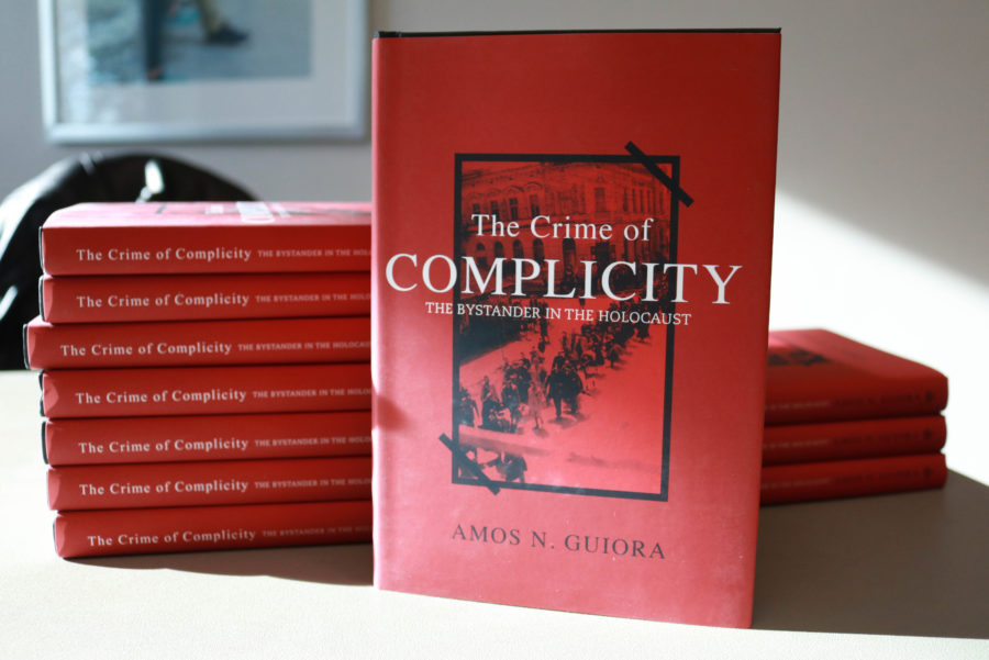The Crime of Complicity: The Bystander in the Holocaust is a book by Amos N. Guiora. It shares the stories of those who were bystanders of Jews taken during the Holocaust. (Abby Van Ess / The Signpost)