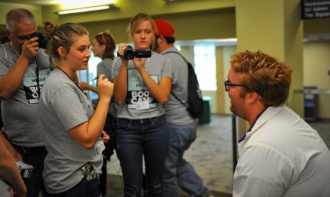 Charles Bowker, right, plays a doctor in a mock scenario at an investigative journalism bootcamp, a camp Signpost staff and nearby Utah student journalists instructed for high school students interested in pursuing journalism. (Photo by Adam Fondren)