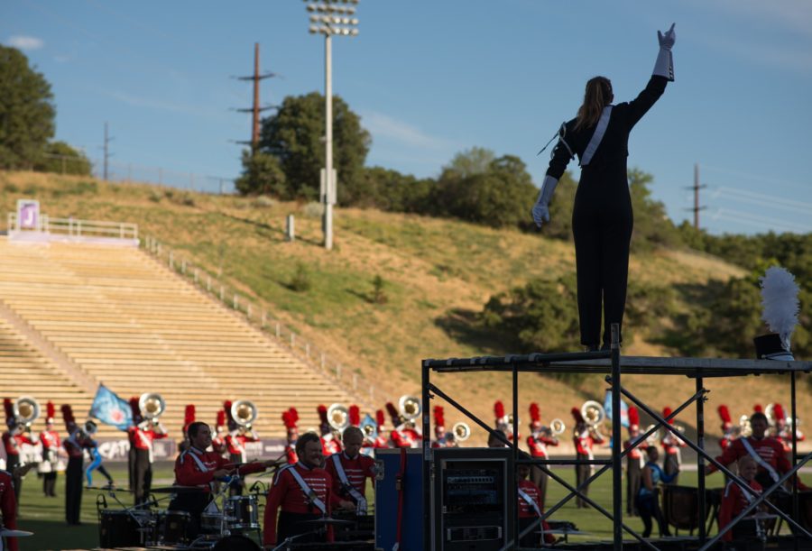 Drum Major Kylie Lincoln, upper-right, leading her drum corps, The Battalion. (Joshua Wineholt / The Signpost)