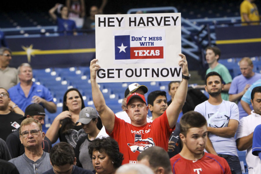 Fans show support for the people of Houston dealing with the effects of Hurricane Harvey during the game between the Texas Rangers and the Houston Astros at Tropicana Field in St. Petersburg, Fla., on Tuesday, Aug. 29, 2017. The Astros are using the Tampa Bay Rays home park due to flooding in Houston. (Will Vragovic/Tampa Bay Times/TNS)