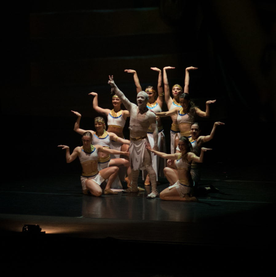Dancers pose at the finale of their performance. (Joshua Wineholt / The Signpost)