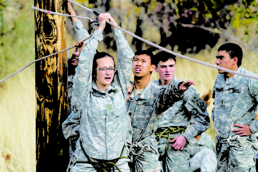 JROTC students helping each other make a rope beam.  (Sara Parker / The Signpost)