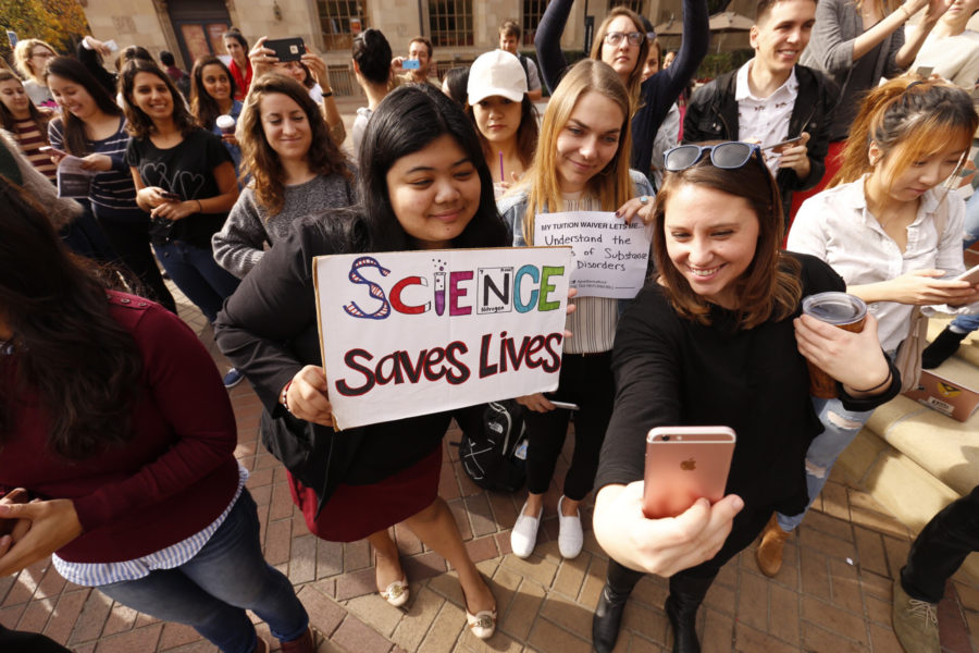 LOS ANGELES CA  NOVEMBER 29, 2017 -- USC Graduate students Mariel Bello, Nina Christie and Alyssa Morris, left to right, pose for a selfie to post online and forward to their congressman as USC Graduate students stage a national rally with over 40 other schools to protest the GOP tax bill, which they say will significantly boost their taxes. (Al Seib / Los Angeles Times/TNS)