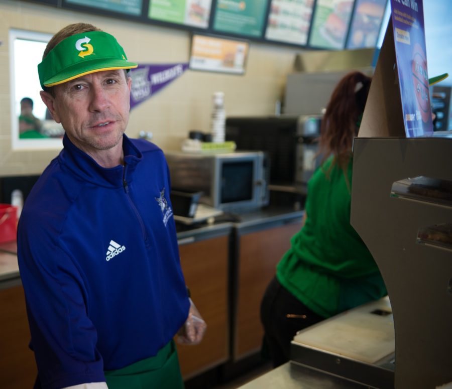 Coach Rahe working at Subway as part of Coaches vs. Cancer, on January 22. (Joshua Wineholt / The Signpost)