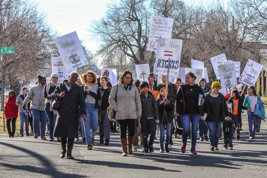 Participants carried decorated signs as they marched from 28th Street to 25th Street in honor of Martin Luther King Jr. on Monday. Photo credit: Chloe Walker