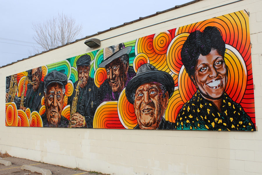 A mural created by Brent Atwood in honor of local jazz musician Joe McQueen hangs on the side of Salty Creative at 443 27th Street.