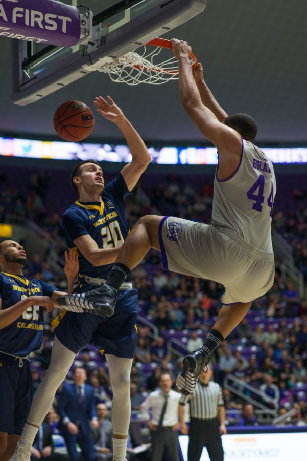 A dunk by Wildcat center Zach Braxton flies in the faces of Northern Colorado defenders. (Joshua Wineholt / The Signpost)