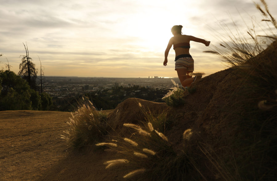 A woman runs in Griffith Park at sunset in temperatures above 80 degrees on January 29, 2018. (Christina House/Los Angeles Times/TNS)