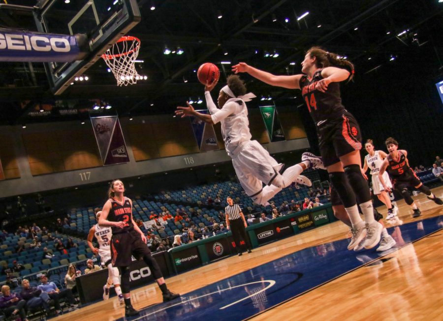 Junior Jaiamoni-Coleman leaps to shoot a basket during the Big Sky Champiosnhop quarterfinal against Idaho State.  (Ariana Berkemeier / The Signpost)