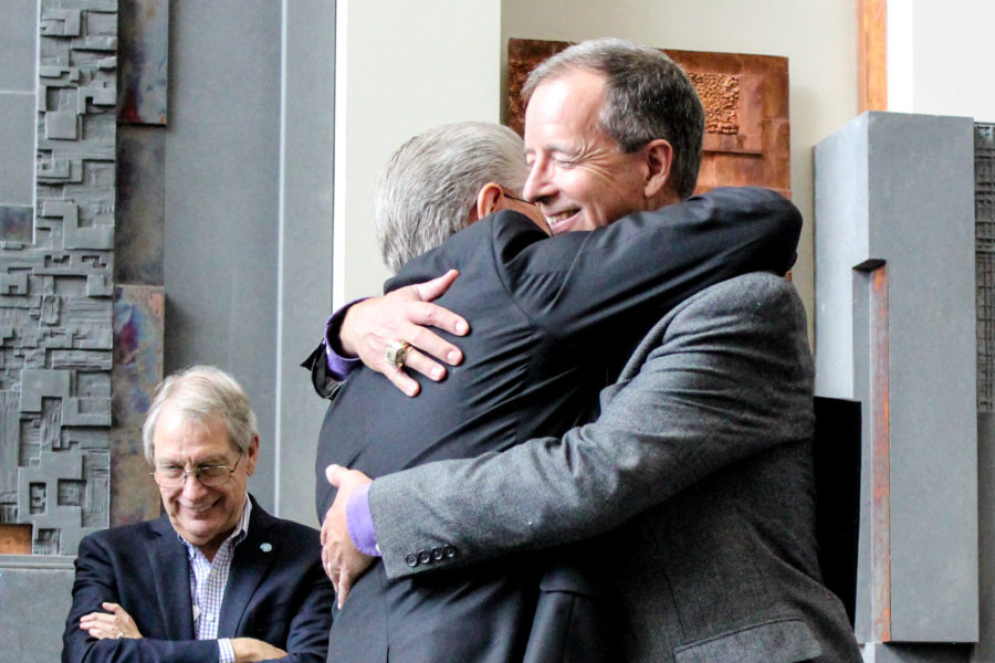 Alan Hall and Charles Wright embrace after Hall gave opening remarks at the farewell social on April 13. Photo credit: Chloe Walker