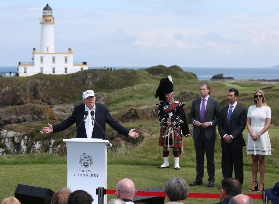 From right, Ivanka, Donald Jr.and Erik Trump listen as their father, Donald Trump, speaks at Turnberry hotel in South Ayrshire, home of the Trump Turnberry golf course, on June 24, 2016. (Andrew Milligan/PA Wire/Abaca Press/TNS)