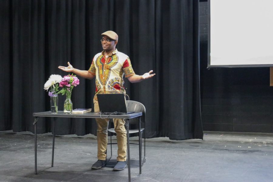 Tyehimba Jess starting his poetry presentation at St. Josephs High School. (Sarah Catan / The Signpost)