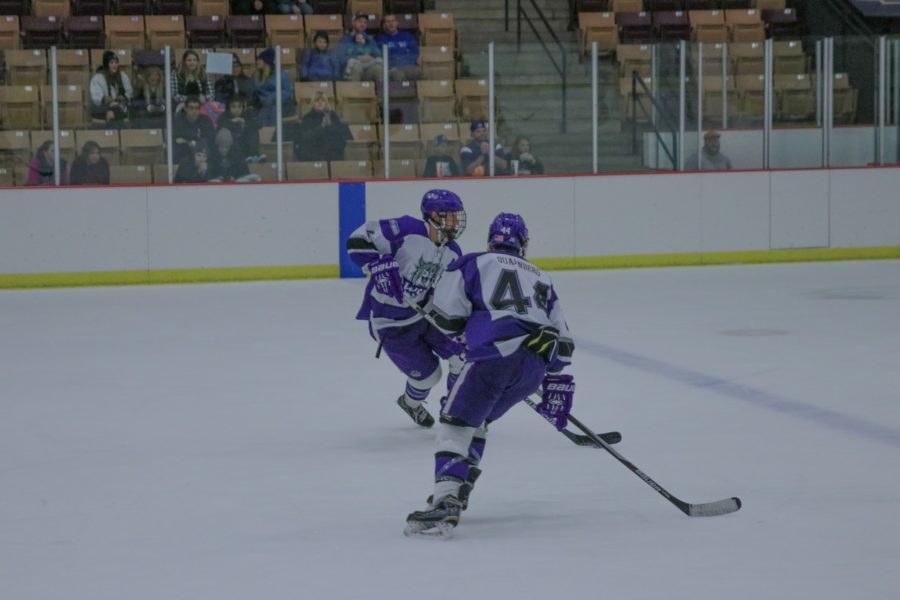 Ken Gorges (4) and Troy Quarnberg (44) securing the puck and ready to move to offence. (Sarah Catan / The Signpost)