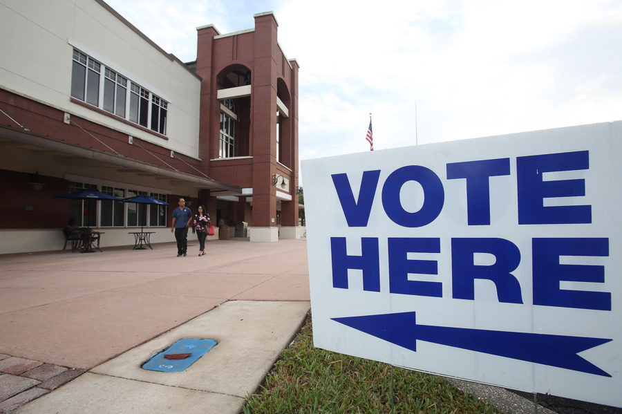 Voters leave the polling place at the Leesburg Public Library early Nov. 6.  (Stephen M. Dowell/Orlando Sentinel)