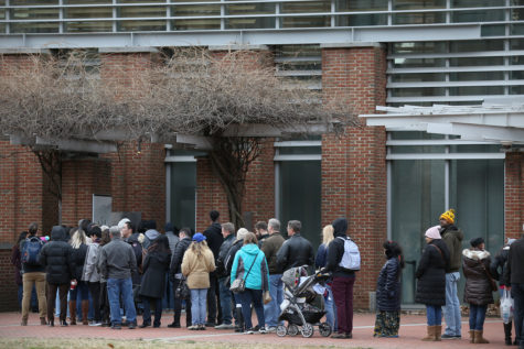 Tourists wait in line to see the Liberty Bell in Philadelphia -- possible only through a window Saturday because of a partial federal government shutdown impacting the National Park Service. TIM TAI / Staff Photographer