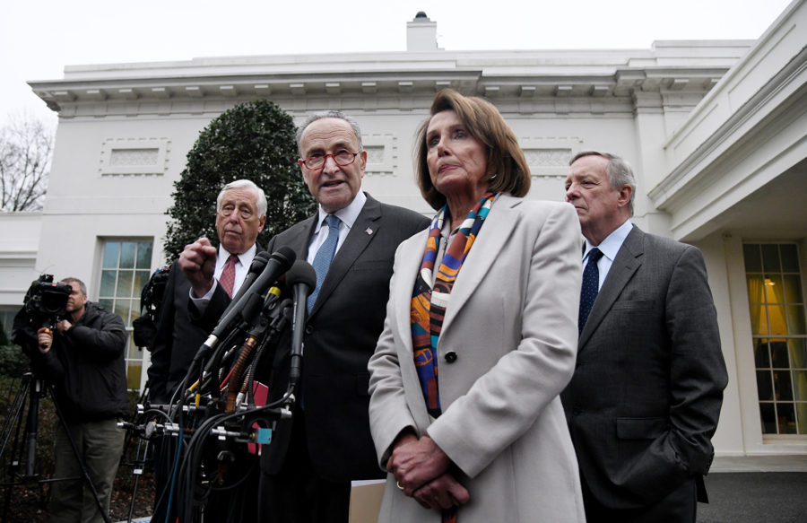 Democratic Congressional leaders, including House Speaker Nancy Pelosi and Senate Minority Leader Chuck Schumer, speak outside the West Wing of the White House after meeting with President Donald Trump on Jan. 2 in Washington, D.C. (Olivier Douliery/Abaca Press/TNS)