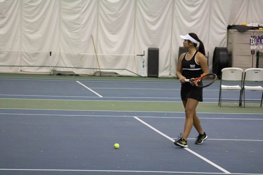 Yuna Ukita preparing for her match with the Weber State University wildcats. (Bella Torres / The Signpost).
