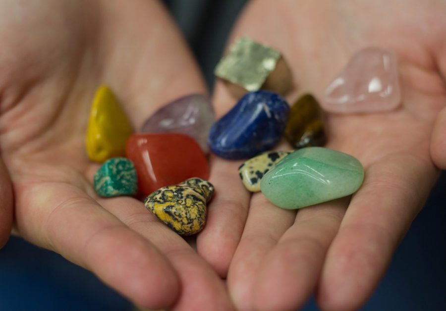 A handful of stones such as cherry quartz, light jade, and dalmation jasper. (Kelly Watkins / The Signpost)