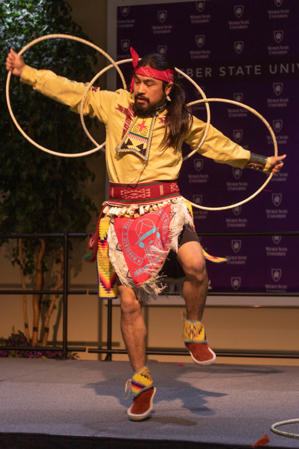 Carl Moore preforming a Native American Hoop Dance. (Marissa Wolford / The Signpost)
