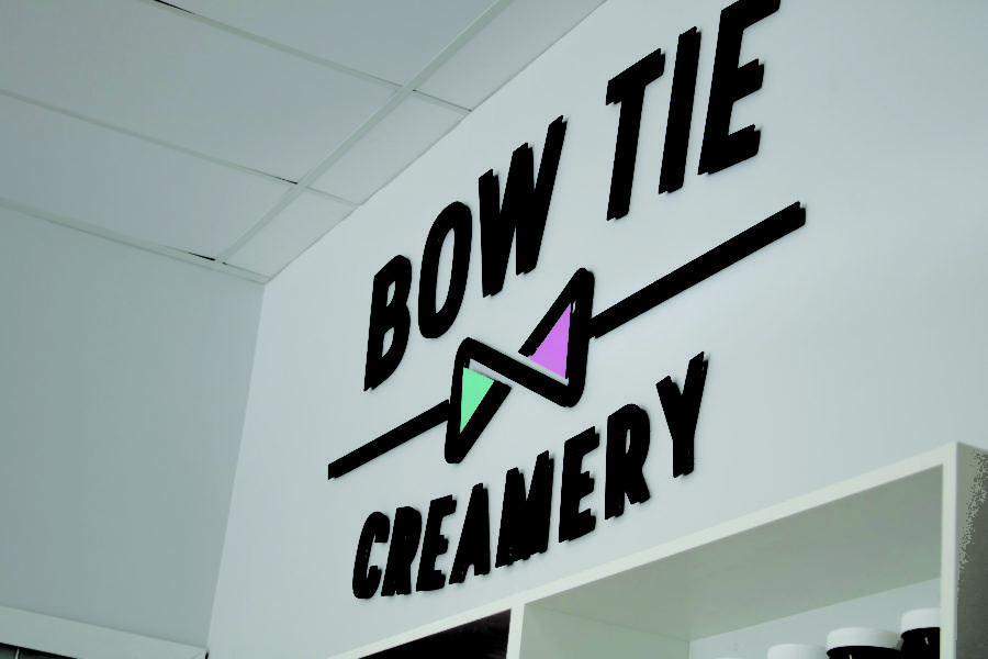 Bow Tie Creamery logo within the building. (Bella Torres / The Signpost).