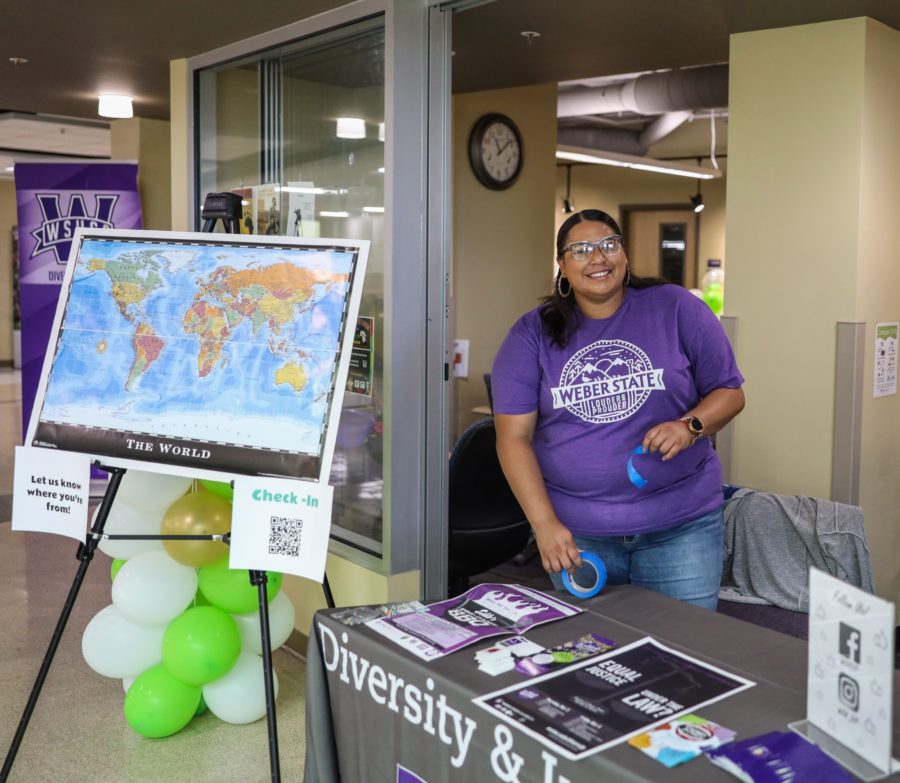 Andrea S. Hernandez, Coordinator, gets ready for the Open House Event at the Center For Diversity and Unity. (Robert Lewis / The Signpost)