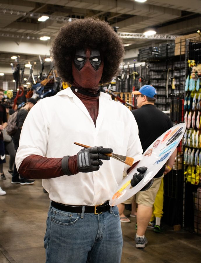 Taylor Brimhall cosplaying as Rosspool, a crossover of Deadpool and Bob Ross. (Kalie Pead/ The Signpost)