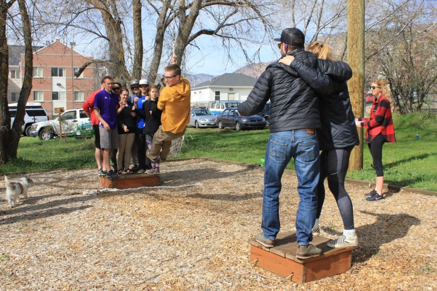 Students participate in a rope swinging obstacle on the WSU Challenge Course. The course is offered to campus clubs and organizations on request starting in the spring. 
(Photo by Weber State University)