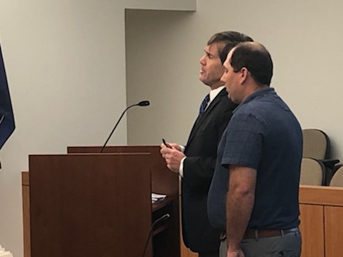 Sunford, who was tried last year for four counts of voyeurism committed on the WSU campus, standing with his lawyer during his case review. (Deborah Wilber/ The Signpost)