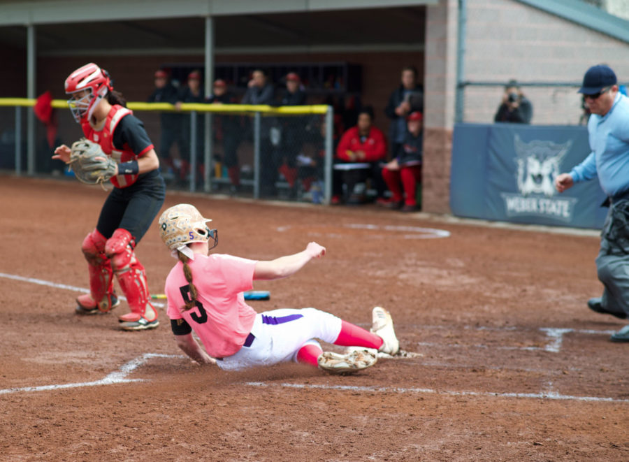 Takesha Saltern slides home for the ‘Cats. (Joshua Wineholt / The Signpost)
