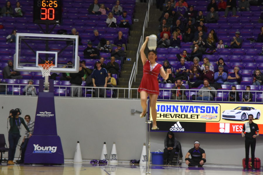 The Red Panda acrobat entertains the Dee Events Center audience during halftime on Feb. 6. (Nikki Dorber / The Signpost)