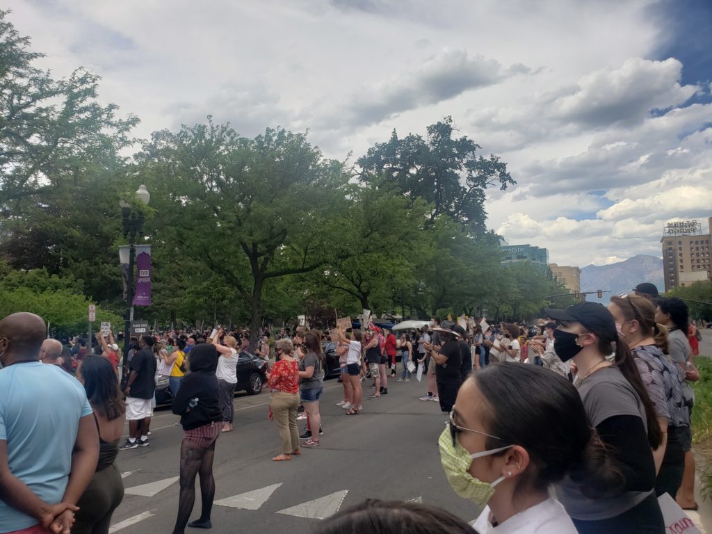 A crowd sits at the bottom of the Ogden/Weber Municipal Building during a Black Lives Matter Protest taking place in Ogden, Utah on May 30. (Francia Benson).