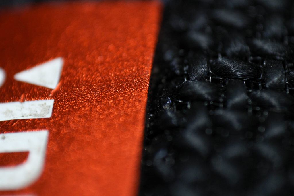 Reversed lens macro of a speaker. (BriElle Harker / The Signpost)