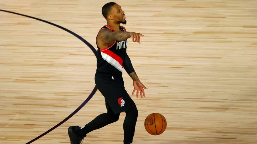 Damian Lillard does not allow the silence of the arena to get the best of him, and continues to play as if all was normal. Photo credit: MCT