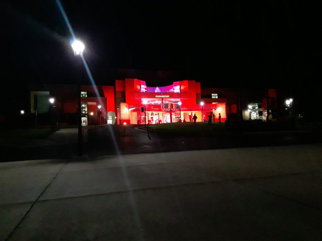 The Browning Center was lit by red lights on the evening of Sept. 1 for. (Caitlyn Nichols / The Signpost)