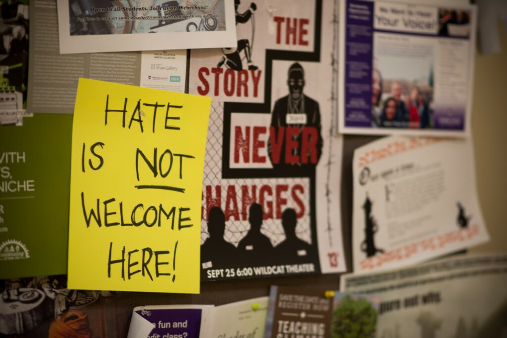 One of several signs which hang in Elizabeth Hall, each a response to the white nationalist flyers recently posted and then removed. (Joshua Wineholt / The Signpost)