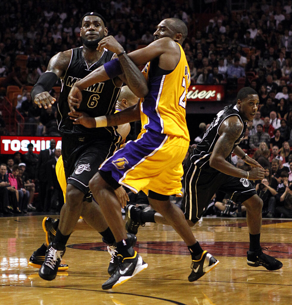 Miami Heat's LeBron James gets tangled with Los Angles Lakers's Kobe Bryant in the second quarter at the American Airlines Arena in Miami, Florida, January 19, 2012. (Charles Trainor Jr./Miami Herald/TNS)