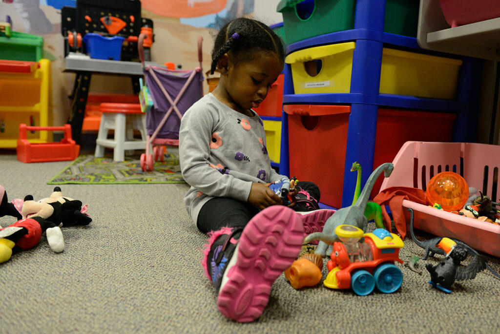 A child playing with group toys, an old norm amid the pandemic.