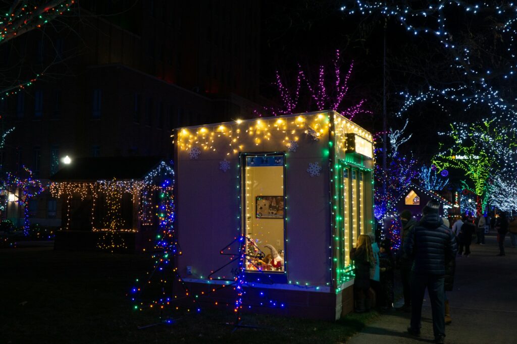 Each little house features local organizations/businesses that showcase what they offer to the community. (Israel Campa / The Signpost)