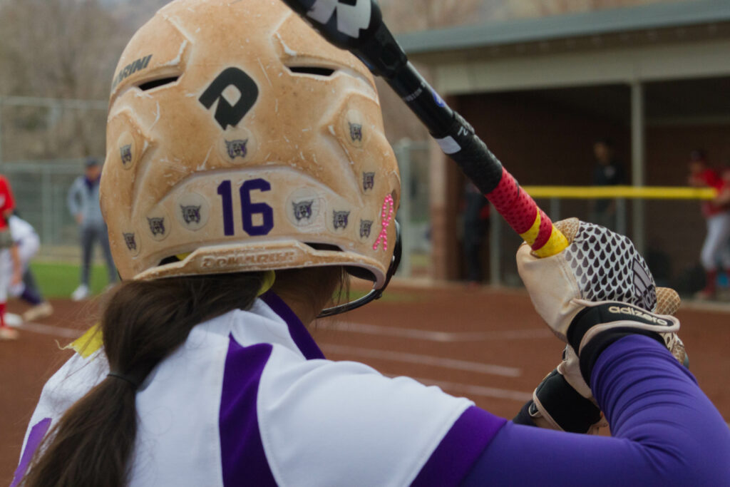 No. 16 Chloe Camarero gears up to take a swing at home plate. (Kelly Watkins / The Signpost)