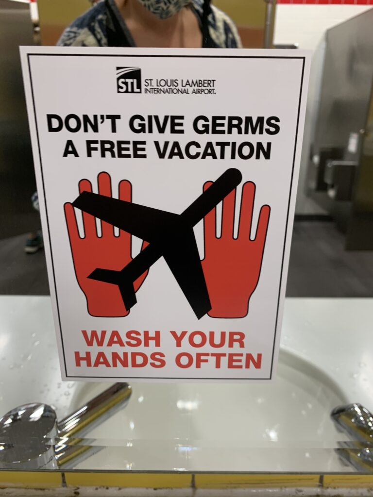 Signs asking all guests to wash their hands, are in the bathrooms of the St. Louis Lambert International Airport. (Kandice Harris)