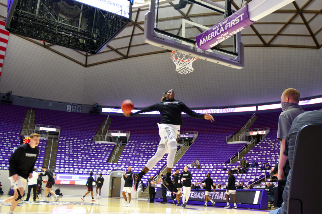 A bit of pregame action by Weber State University's #21/Center, Dontay Bassett, at Thursday's game. (Nikki Dorber / The Signpost)