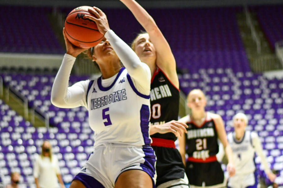 Jadyn Matthews, number 5, on Weber States Womens Basketball team, sets for two points, at Saturdays game.  (Nikki Dorber / The Signpost)