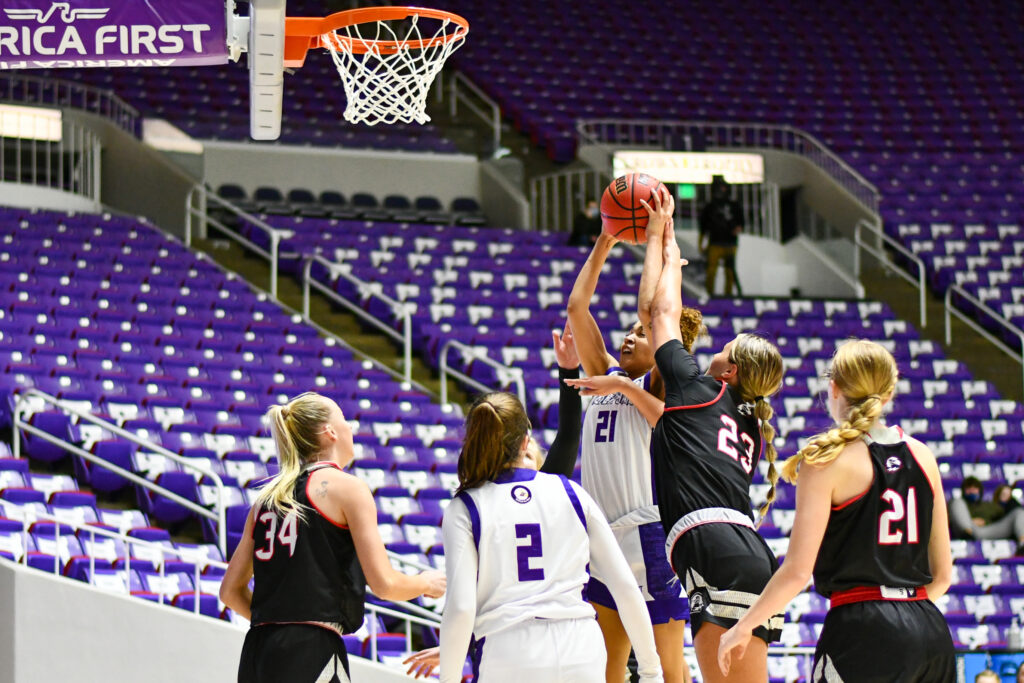 Daryn Hickok fights for a basket in the game against SUU on Jan. 23. (Nikki Dorber / The Signpost)