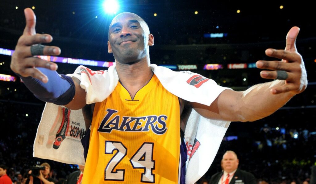 LOS ANGELES, CALIFORNIA; APRIL 13, 2016-Lakers' Kobe Bryant is about to hug his family after the game at the Staples Center Wednesday. (Wally Skalij/Los Angeles Times)