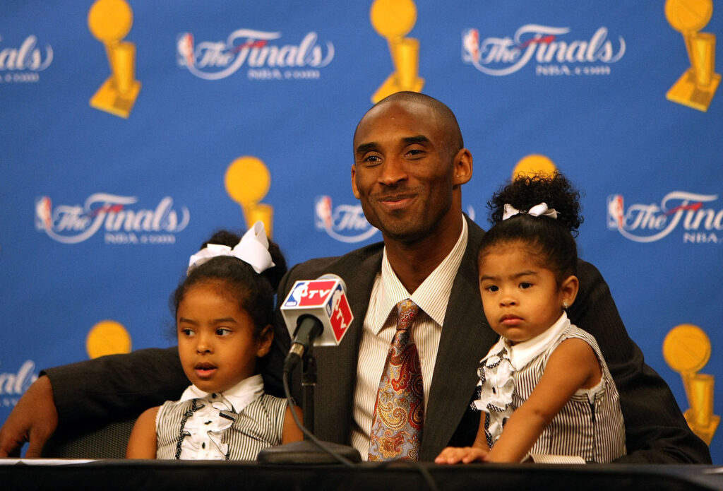 The Los Angeles Lakers' Kobe Bryant sits with daughters Natalia, left, and Gianna, right, during a news conference after the Lakers' win against the Boston Celtics in Game 5 of the 2008 NBA Finals on June 15, 2008, at Staples Center in Los Angeles. (Jed Jacobsohn/Getty Images/TNS)
