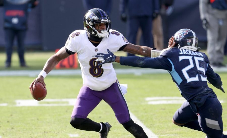 Lamar Jackson #8 of the Baltimore Ravens runs with the ball  while defended by Adoree Jackson #25 of the Tennessee Titans in the Wild Card Round of the NFL Playoffs at Nissan Stadium on Jan. 10, 2021 in Nashville, Tennessee. (Andy Lyons/Getty Images/TNS)