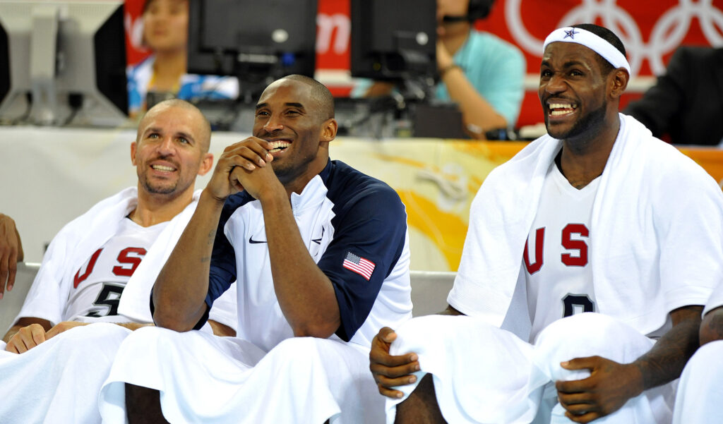 Jason Kidd, left, Kobe Bryant, center, and LeBron James of the United States share a laugh on the bench during a game Australia on Wednesday, August 20, 2008, in the Games of the XXIX Olympiad in Beijing, China. (Joe Rimkus Jr./Miami Herald/TNS)