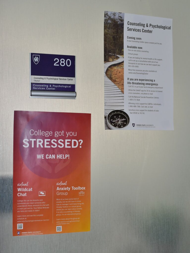 Informative flyer hang on the entrance to the Counseling and Psychological Services Center at Weber State University. (Paige McKinnon/The Signpost)