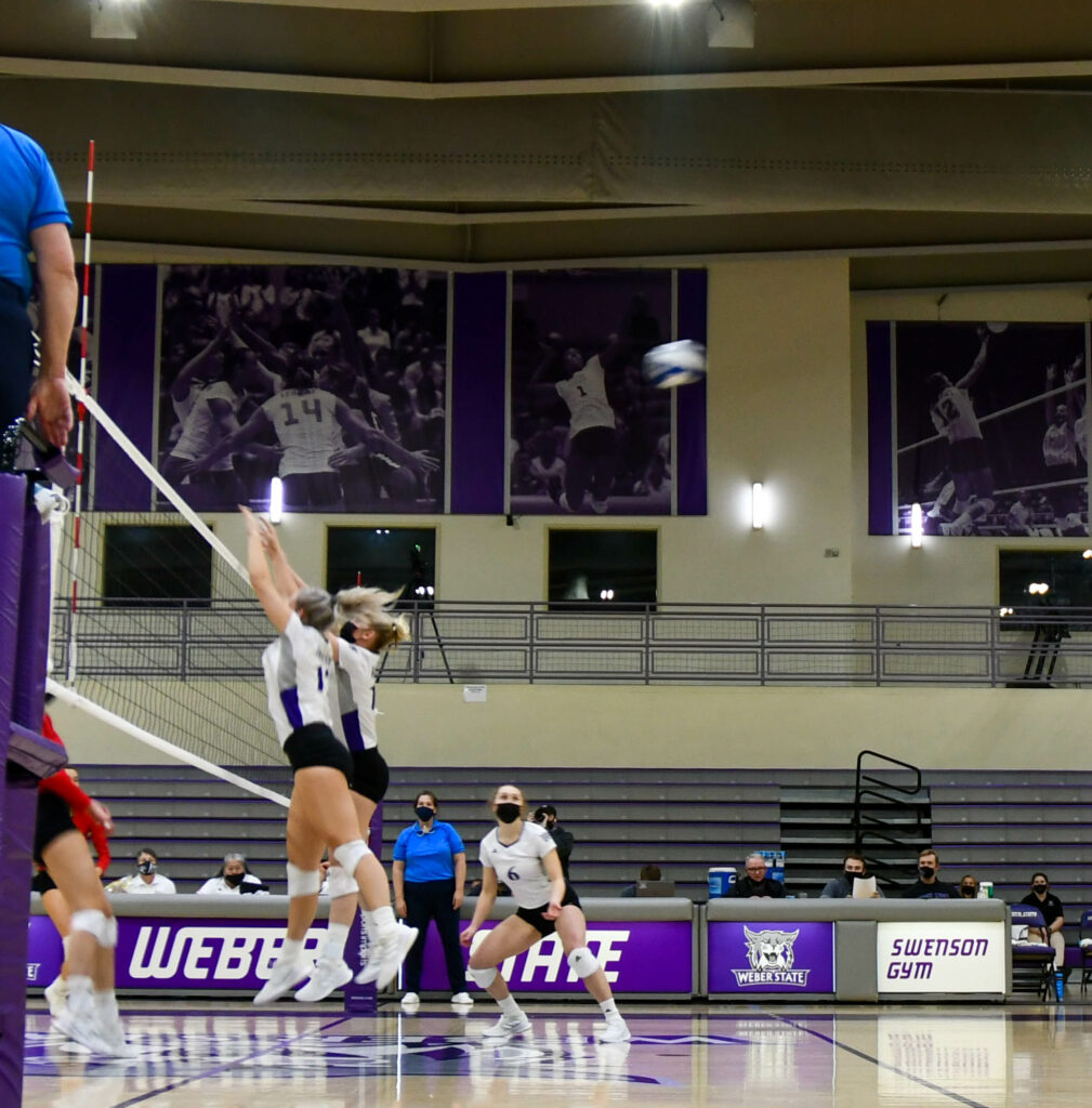 Defending the win at the net, Wildcats work as a team to claim a victory at the end of the second game against Southern Utah University. (Nikki Dorber / The Signpost)