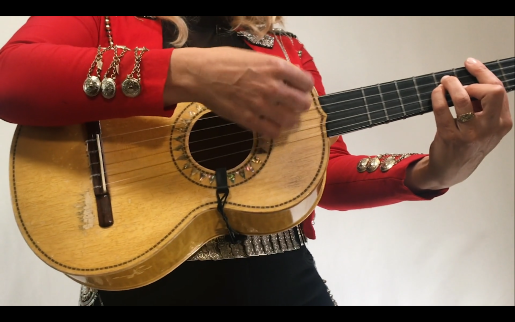 Shae Fiol strums away on the vihuela during Flor de Toloache's performance on Feb. 5.